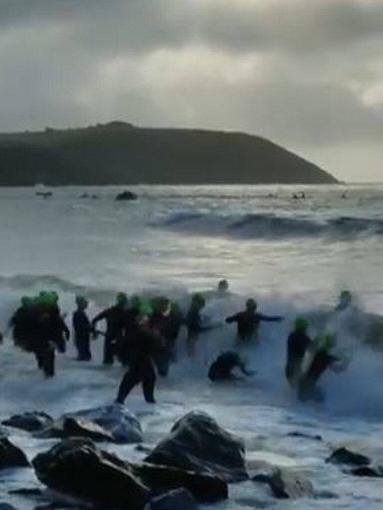 Athletes battled to get past the waves.