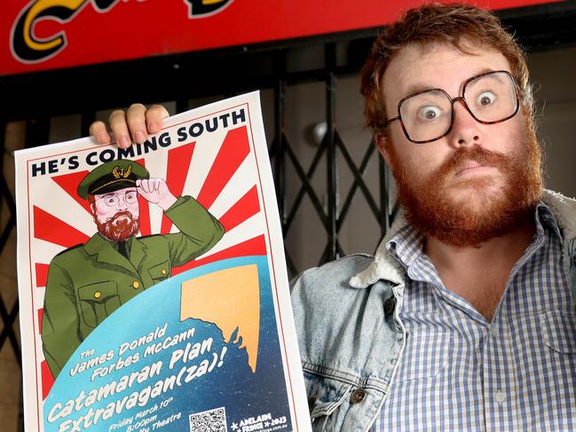 Comedian James Donald Frobes McCann outside Royalty Theatre with poster featuring red Rising Sun, banned by Adelaide Fringe, and a new yellow background version. 2 February 2023. Picture Dean Martin