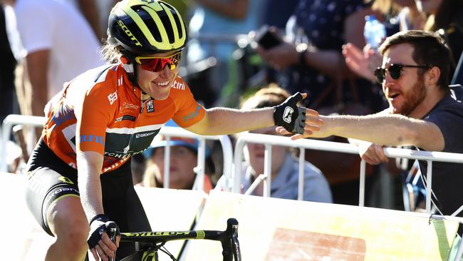 Overall winner Amanda Spratt riding for Mitchelton-Scott high fives the crowd. Picture: Sarah Reed