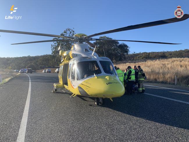 Two injured, man cut from car in head-on crash