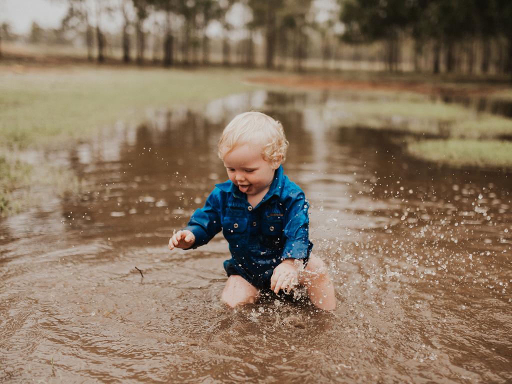 Hayes Pugh playing in puddles at Springview Station, Mingela. Picture: Vicki Miller