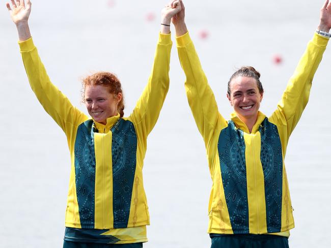 PARIS, FRANCE - AUGUST 02: Bronze medalists Jess Morrison and Annabelle McIntyre of Team Australia celebrate on the podium at the Rowing Women's Pair medal ceremony on day seven of the Olympic Games Paris 2024 at Vaires-Sur-Marne Nautical Stadium on August 02, 2024 in Paris, France. (Photo by Alex Davidson/Getty Images)