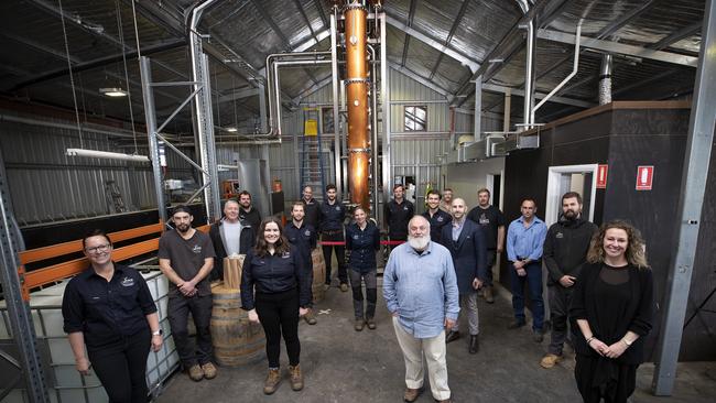 The crew at Lark Distilling Co., with the new column still in the background. Picture: Chris Kidd