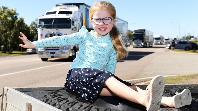 Darcie White, 5, from Mt Low watches The Transporter Parade in Townsville. Picture: Shae Beplate.