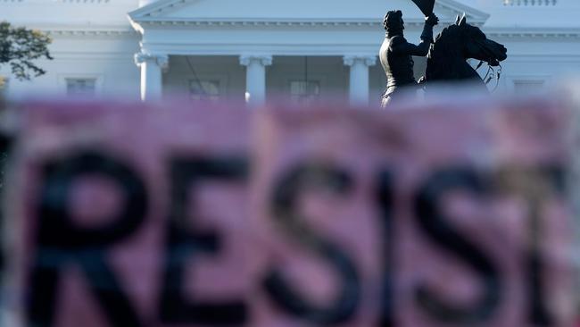 A banner that says “resist” is seen outside the White House. Picture: AFP