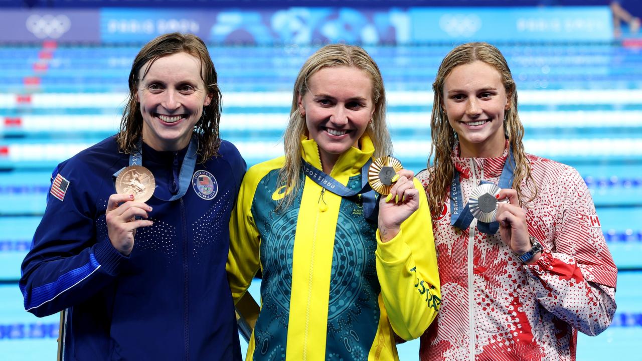 Katie Ledecky (left) will lock horns with Summer (right) at the worlds in Singapore. Aussie Ariarne Titmus (middle) lost her world record and won’t compete. (Photo by Sarah Stier/Getty Images)