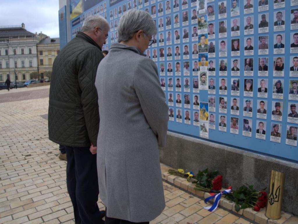 Penny Wong with Andrii Sybiha, look at photos of Ukrainians killed in the war with Russia. PIC: Mazoe Ford