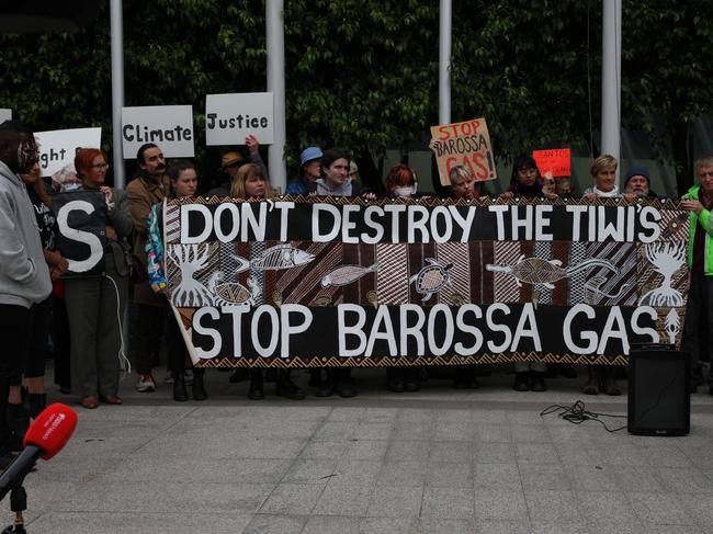 MELBOURNE, AUSTRALIA - NOVEMBER 15: Protesters hold a banner at the front of the Federal Court Of Australia on November 15, 2022 in Melbourne, Australia. The Federal Court is hearing an appeal by Santos Ltd., which seeks to restart drilling in the Barossa Gas project, located near the Tiwi Islands off the northern coast of Australia. Courts had earlier ruled the approval for drilling in the project as invalid. (Photo by Tamati Smith/Getty Images)