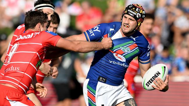 SUNSHINE COAST, AUSTRALIA - MARCH 12: Josh Curran of the Warriors attempts to break away from the defence of Andrew McCullough of the Dragons during the round one NRL match between the New Zealand Warriors and the St George Illawarra Dragons at Sunshine Coast Stadium, on March 12, 2022, in Sunshine Coast, Australia. (Photo by Bradley Kanaris/Getty Images)