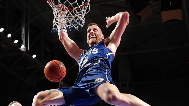 Mitch Creek dunks during the Adelaide 36ers’ last season. Picture: Daniel Kalisz (Getty)