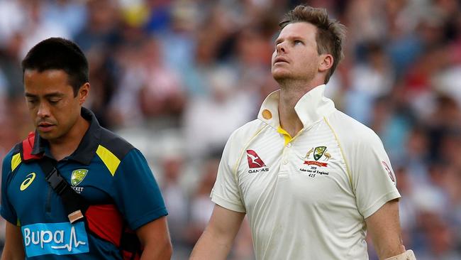 Steve Smith is taken from the field after being struck in the head. Picture: Ian Kington/AFP