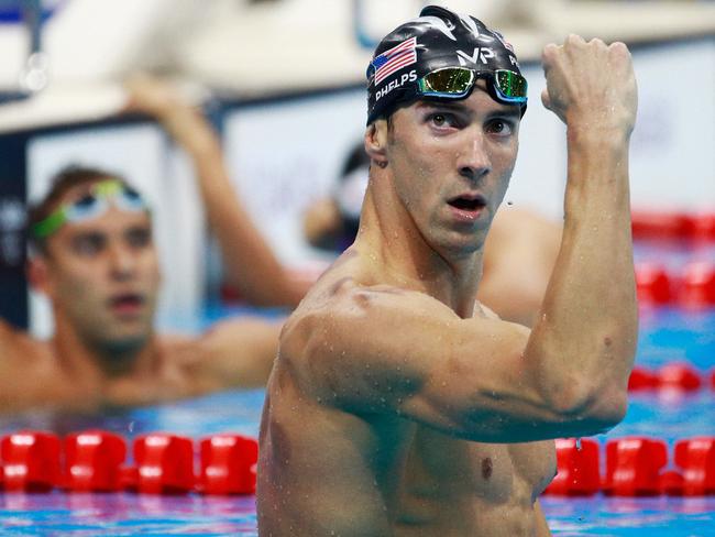 RIO DE JANEIRO, BRAZIL - AUGUST 09: Michael Phelps of the United States celebrates winning gold in the Men's 200m Butterfly Final on Day 4 of the Rio 2016 Olympic Games at the Olympic Aquatics Stadium on August 9, 2016 in Rio de Janeiro, Brazil. (Photo by Adam Pretty/Getty Images)