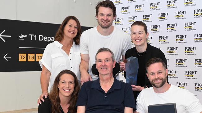 Neale Daniher (front centre) with his family (L-R) Bec (front), Jan (wife), Ben, Lauren and Luke (all Daniher) at Melbourne Airport on his return from Canberra where he won Australian of the Year. Picture: Josie Hayden