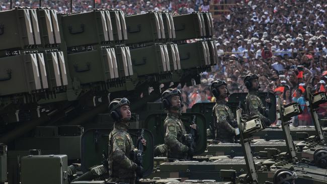 Chinese soldiers sit atop mobile rocket launchers as they drive in a parade to celebrate the 70th Anniversary of the founding of the People's Republic of China in 1949, at Tiananmen Square on October 1, 2019 in Beijing, China. (Photo by Kevin Frayer/Getty Images)