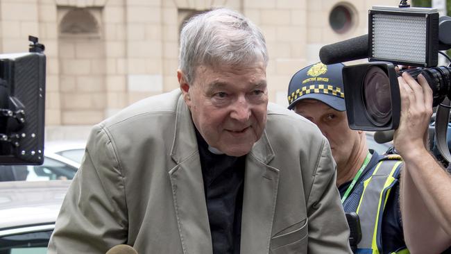 Cardinal George Pell arrives at the County Court in Melbourne this year.