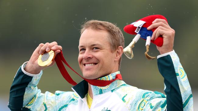 PARIS, FRANCE - SEPTEMBER 07: Gold medalist, Curtis Mcgrath of Team Australia celebrates on the podium during the Para Canoe - Men's Kayak Single 200m - KL2 medal ceremony on day ten of the Paris 2024 Summer Paralympic Games at Vaires-Sur-Marne Nautical Stadium on September 07, 2024 in Paris, France. (Photo by Steph Chambers/Getty Images)