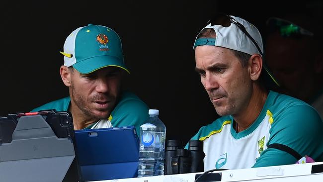 Justin Langer is all business with David Warner in Adelaide.