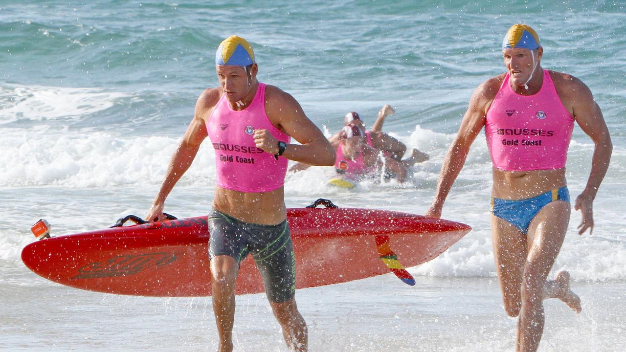 Surfers Paradise father-and-son pair TJ (front) and Trevor Hendy on their way to an emotional win in the open board rescue at a recent Aussies.