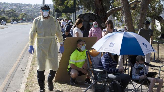 People are turning out in their thousands to coronavirus testing clinics across the city, including huge lines at the Parafield Airport testing tent. Picture: Emma Brasier