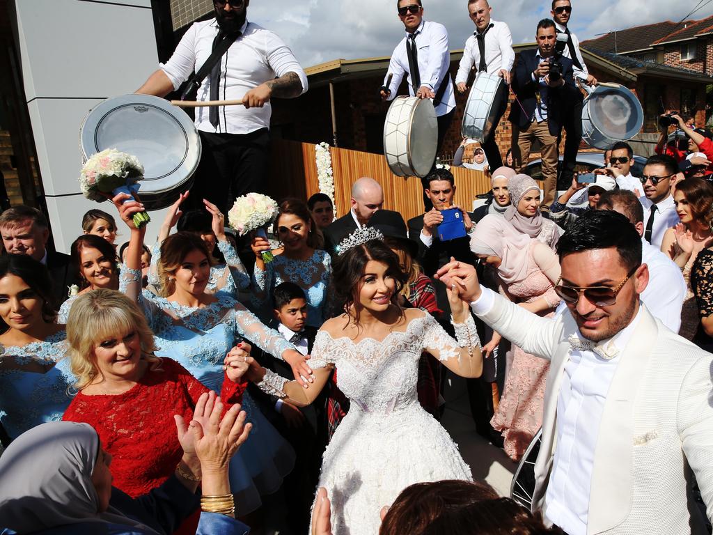 The couple take to dancing in the streets after their wedding. Picture: Toby Zerna