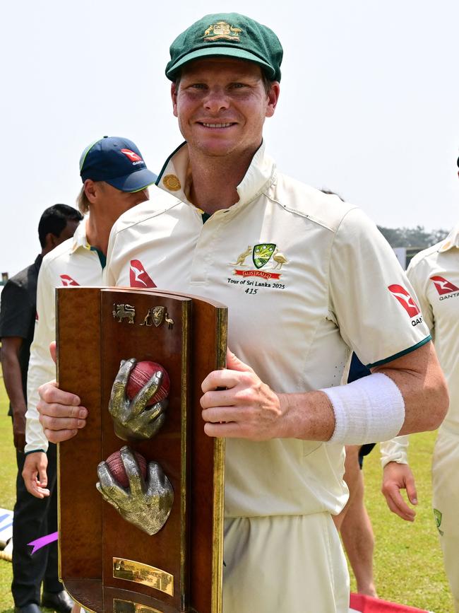 Steve Smith holds the Warne-Muralitharan Trophy after leading Australia to a Test series victory in Sri Lanka last month. Picture: AFP