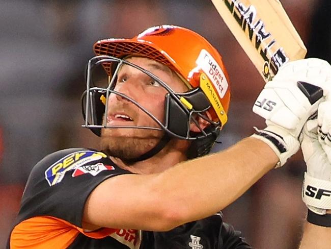 PERTH, AUSTRALIA - JANUARY 03: Laurie Evans of the Scorchers watches the ball after his shot during the BBL match between Perth Scorchers and Adelaide Strikers at Optus Stadium, on January 03, 2024, in Perth, Australia. (Photo by James Worsfold/Getty Images)