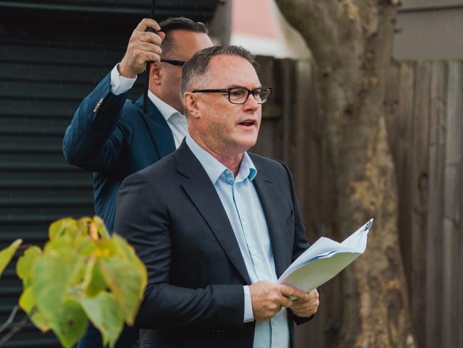 John McGrath at a Sydney auction.
