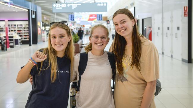 Avid Taylor Swift fans Poppy Letcher, 17, Abby Kennedy, 18, and Lexie Intveld, 18, at Adelaide Airport on Friday before flying to Melbourne. Picture: Roy VanDerVegt