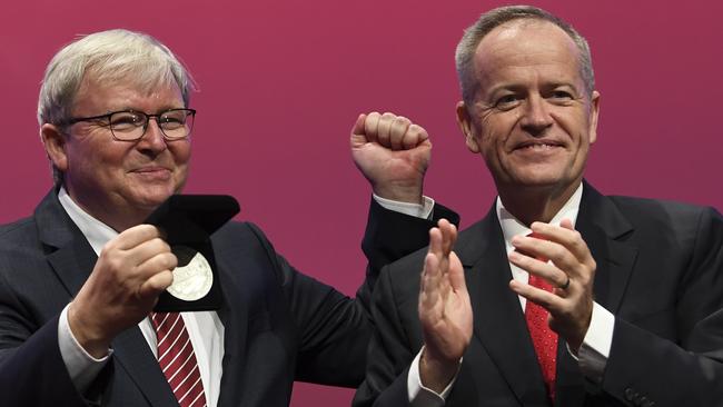 Kevin Rudd receives his Labor life membership from Bill Shorten at the party’s national conference in Adelaide yesterday. Picture: AAP