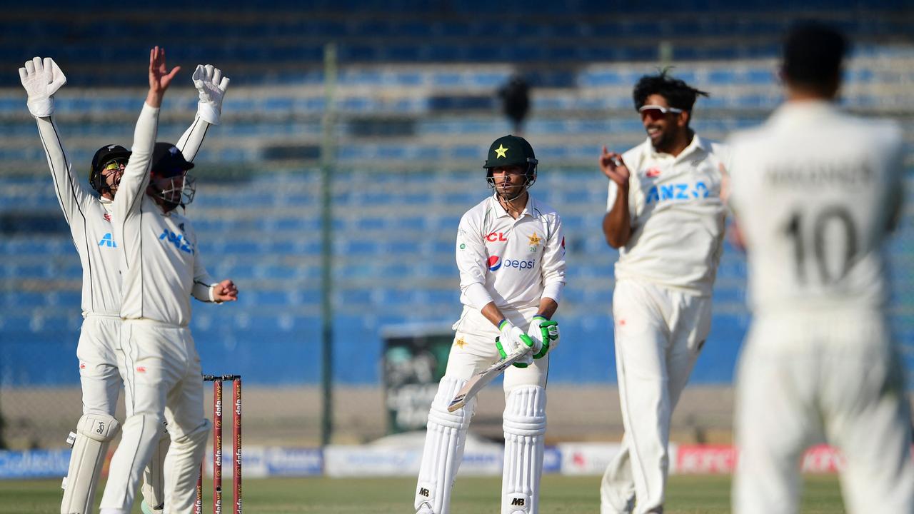 New Zealand's cricketers celebrate after the dismissal of Pakistan's Mohammad Wasim (C) during the fifth and final day of the first Test match between Pakistan and New Zealand at the National Stadium in Karachi on December 30, 2022. (Photo by Asif HASSAN / AFP)