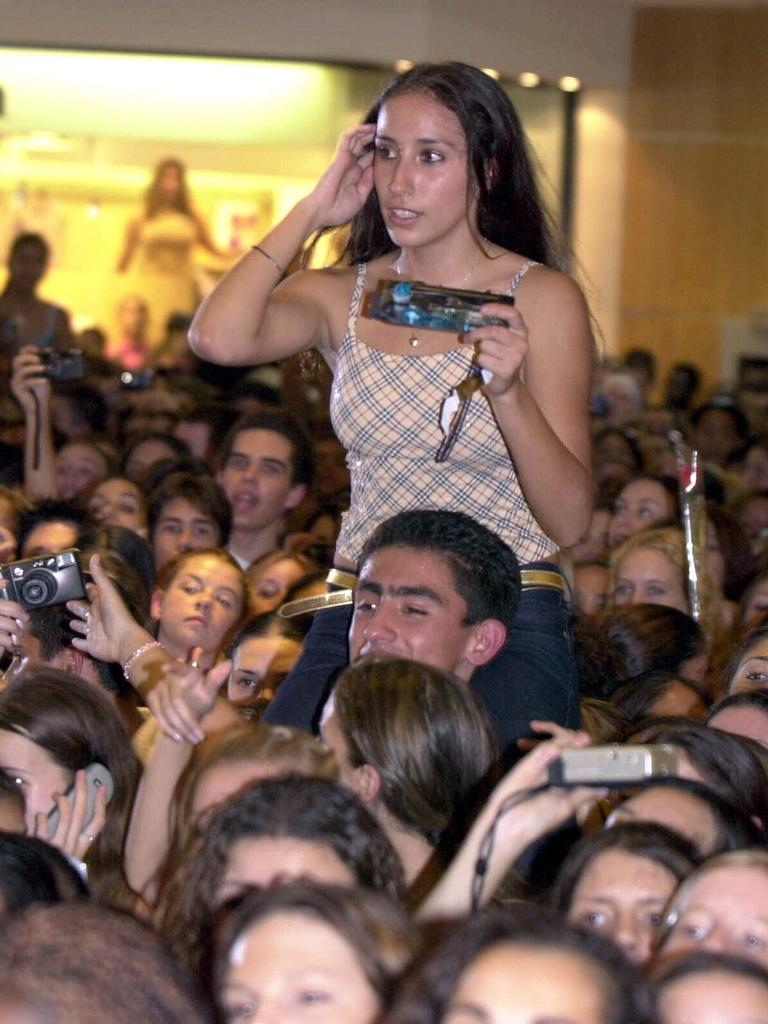 One fan makes sure she gets a better view of Craig David. Picture: Noel Kessel