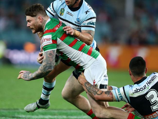 Rabbitoh's Chris McQueen tackled by Shark's Michael Ennis and was then put on report during the NRL finals game between the Cronulla Sharks and the South Sydney Rabbitohs at Allianz Stadium .Picture Gregg Porteous