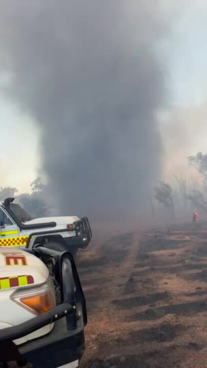 Firenado: A willy willy whipped up smoke at a bushfire ground in Alice Springs