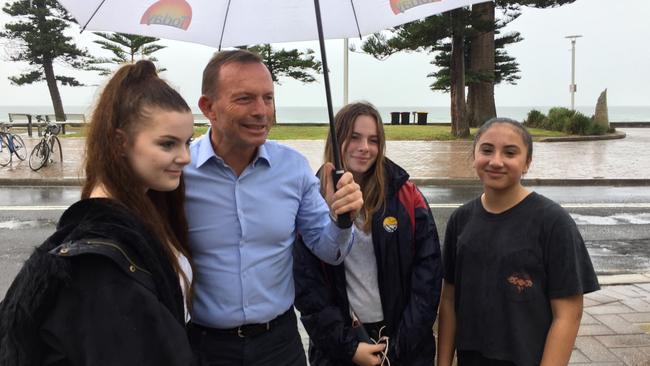 Tony Abbott was seen having coffee at Hemingway’s a few hundred metres away from the protests outside his Manly electorate office.