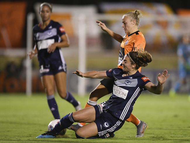 Victory’s Jenna McCormick tackles Matildas teammate, Brisbane Roar’s Tameka Yallop. Picture: Getty Images