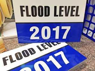 FLOOD SIGNS: Lismore City Council has free signs available for business owners to use to indicate the 2017 flood level in their premises. Picture: Supplied