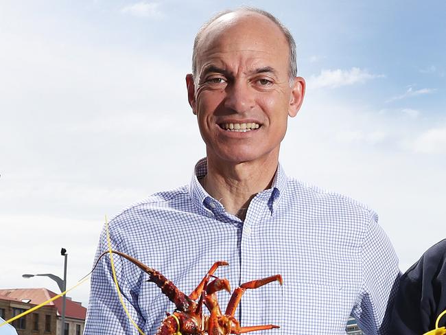 L-R Mark Nikolai Chief Executive Officer TARFish, Primary Industries Minister Guy Barnett, John Sansom Chief Executive Officer Tasmanian Rock Lobster Fishermen's Association Ltd with rock lobster on the Hobart waterfront.  Opening of recreation rock lobster season on the East Coast of Tasmania.  Picture: NIKKI DAVIS-JONES