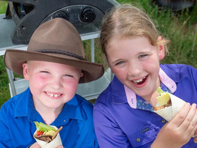 NEWS360. Coles price drops. Dusty Kyle (6) and Milli Kyle (9) (cousins) enjoying the quality meat that their family supplies to Coles. Picture: Supplied