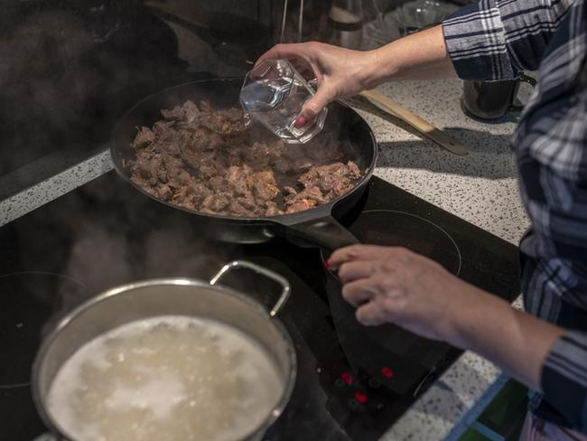 Woman cooking healthy eating. Picture: iStock