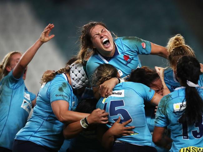 SYDNEY, AUSTRALIA - APRIL 20:  Grace Hamilton of New South Wales (top) and team mates celebrate victory during the Super W Grand Final match between the the New South Wales Women and the Queensland Women at Allianz Stadium on April 20, 2018 in Sydney, Australia.  (Photo by Matt King/Getty Images)