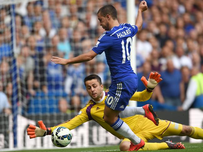 Eden Hazard takes on Swansea goalkeeper Lukasz Fabianski.