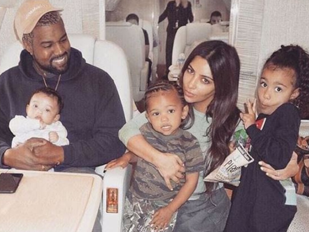 Kim Kardashian and Kanye West with their children Chicago, Saint and North.