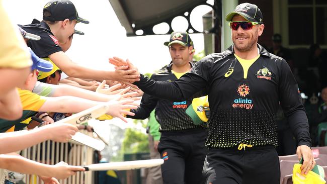 Australian captain Aaron Finch greets fans ahead of a T20 match against Pakistan at the SCG.