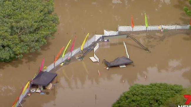 Flood water rises over what was to be Strathpine Magical Christmas Festival. Photo: 7 News Brisbane