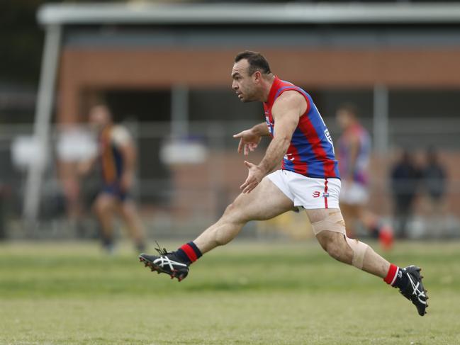 George Angelopoulos takes a kick for Springvale Districts in the Southern league.