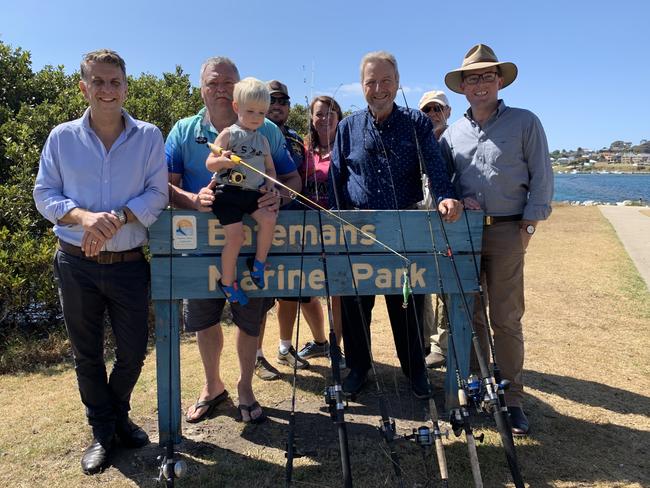 Bega member Andrew Constance and Minister for Agriculture Adam Mashall flank locals at Batemans Bay after the announcement. Picture: Supplied