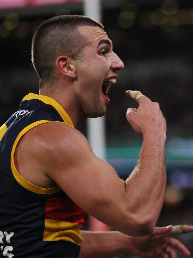 Josh Rachele of the Crows gestures to the crowd after a Showdown 56 goal. Picture: James Elsby/AFL Photos via Getty Images