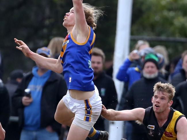 Corey Ellison flies for the ball. Picture: Stuart Milligan