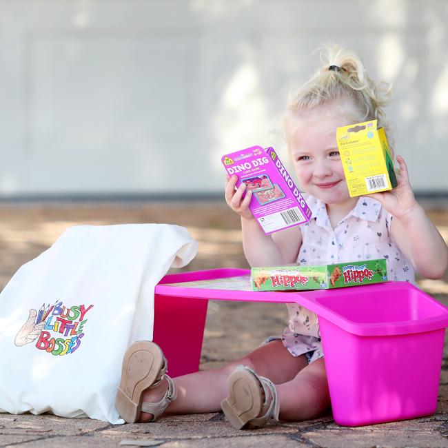 Tom Brewer’s niece Lucy Martin, 2, checking out one of his Busy Little Bosses bags. Picture: Sue Graham.