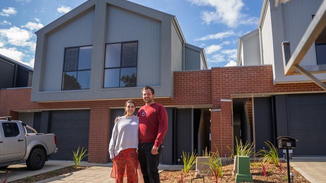 Tim Doherty and Vanessa Reinboth in front of their new Seacombe Gardens home, built with the aid of HomeStart. Picture: Supplied